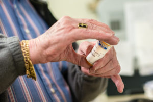 Gerry Reichelderfer, an 81-year-old pharmacist from Hayfork, Calif., works five days per week filling prescriptions at his pharmacy (Photo by Heidi de Marco/KHN).